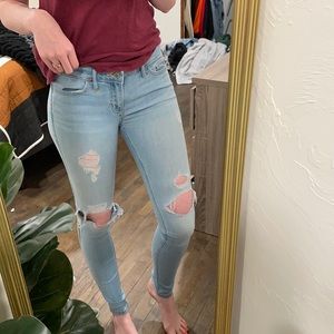 Light wash distressed skinny jeans